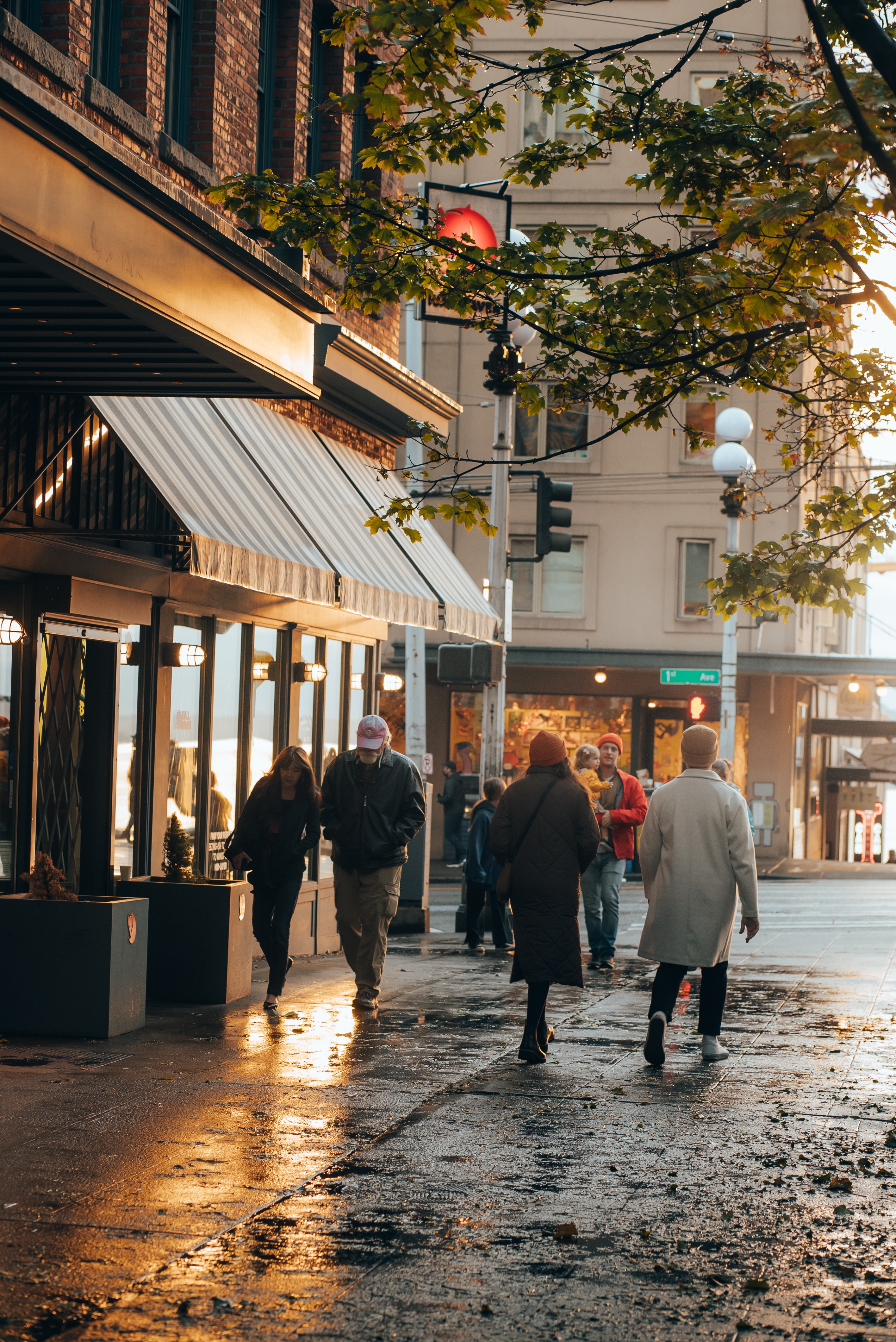 people walking down a market street